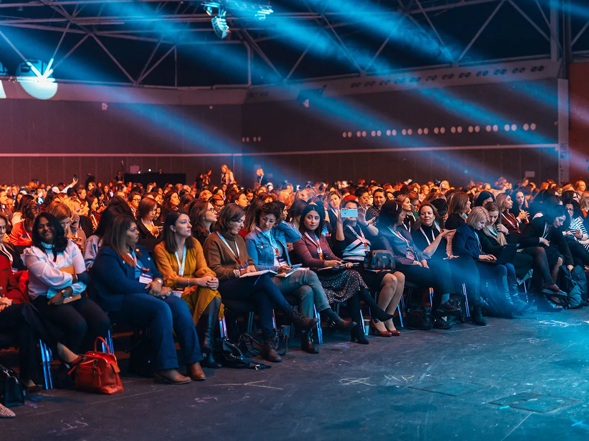 A speaker presenting on stage